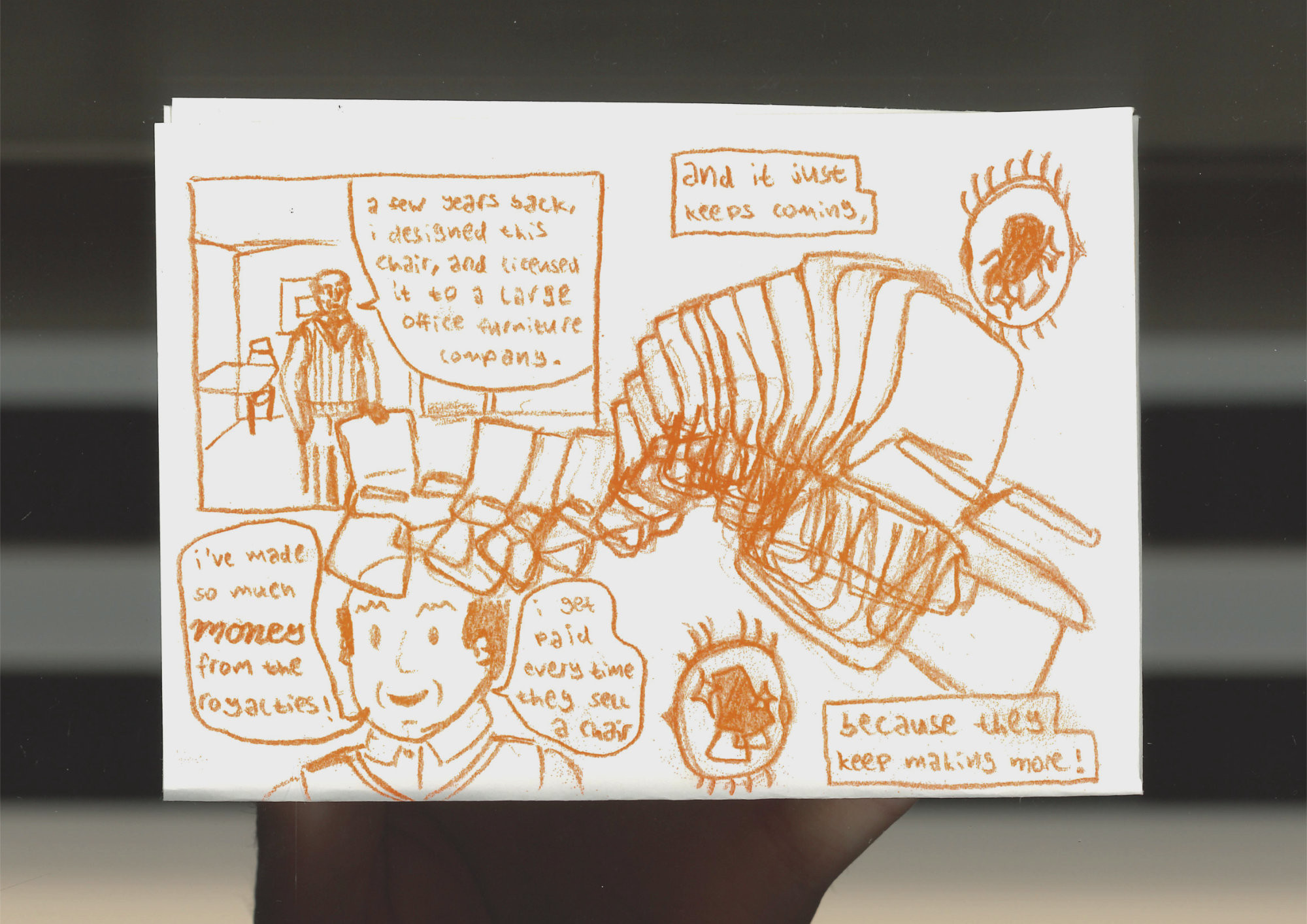 johan holding the backrest of a chair. 